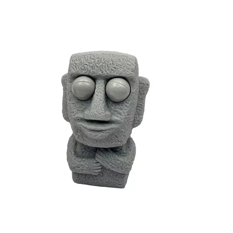 Stone man releases stress toy slowly rebounds soft Moai statue squeeze eyes interested expression relaxes stress children's gift
