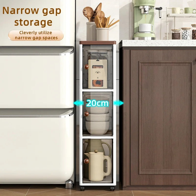The transparent storage cabinet with wheels in the gap saves space in the kitchen and living room for storing snacks