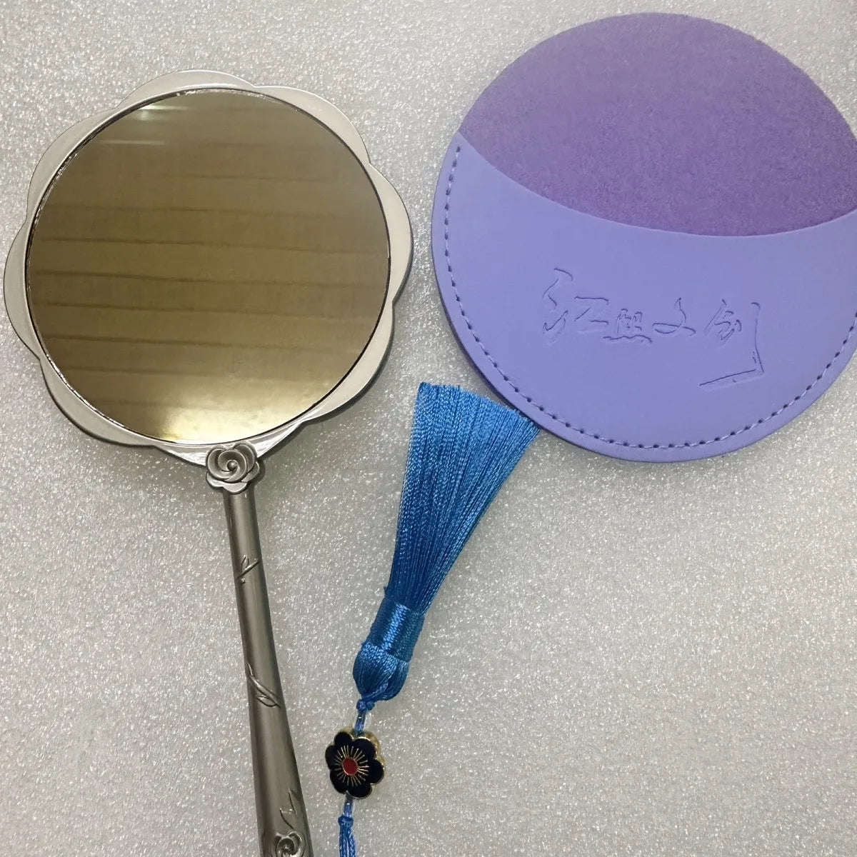 Handheld Relief Metal Mirror from Nanchang Tengwang Pavilion, a Chinese tourist souvenir